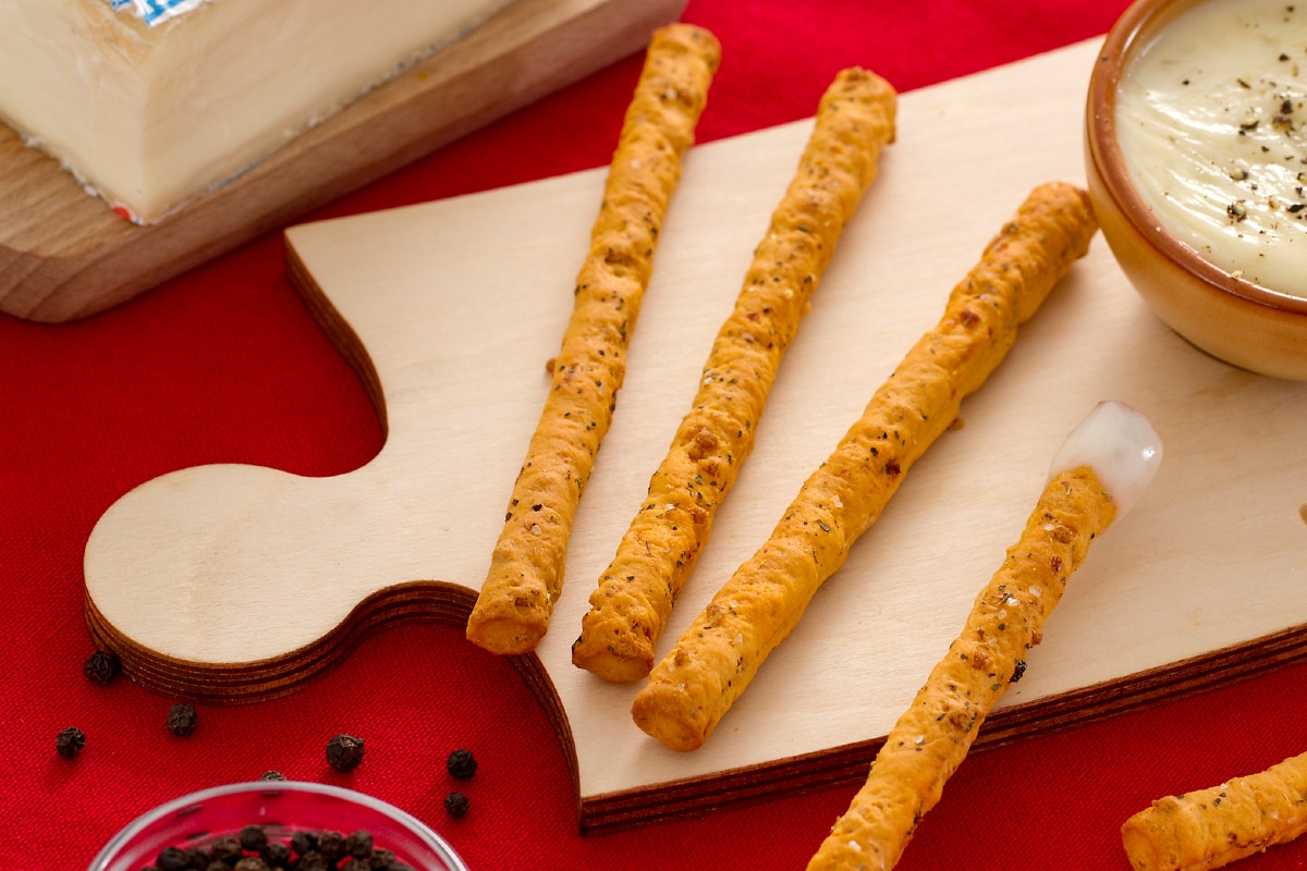 Sfilati com fonduta de pimenta-do-reino